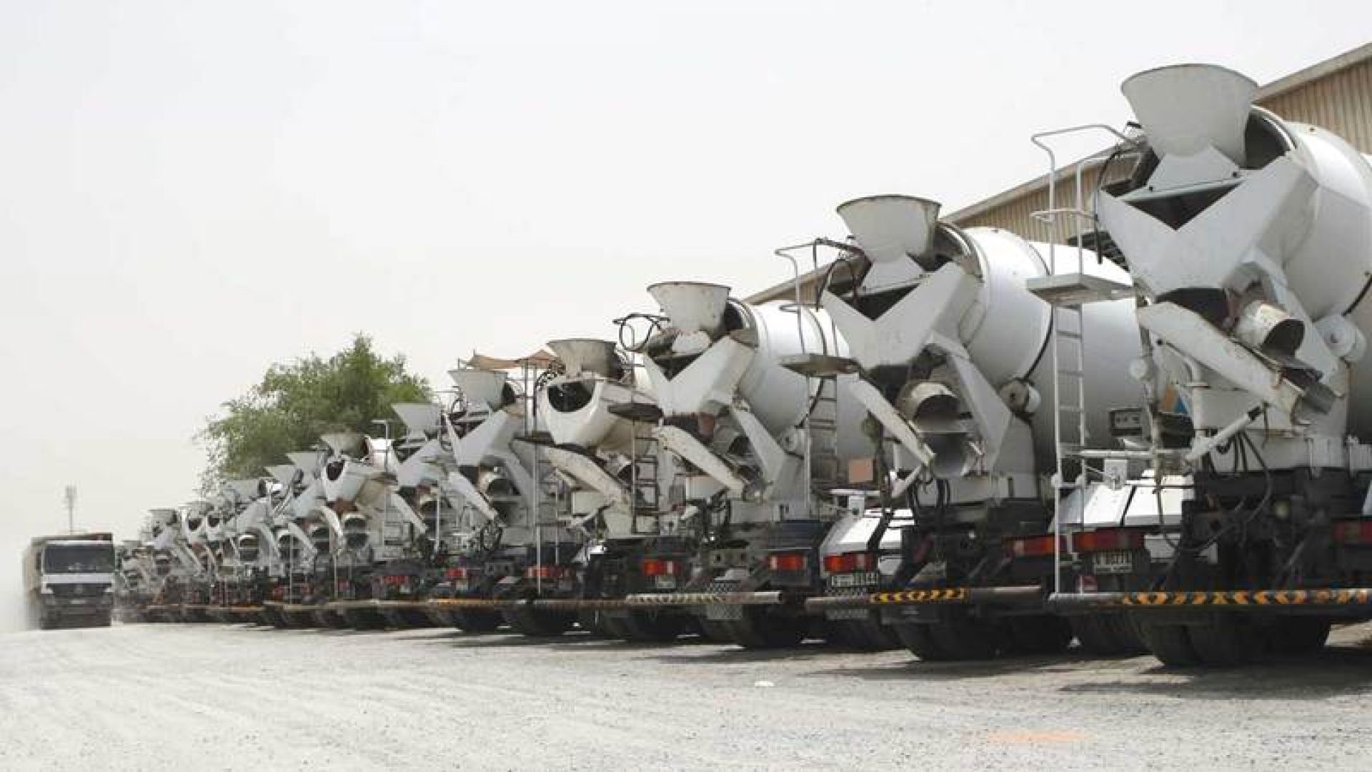 Trucks line up outside a cement factory in the Al Quoz area of Dubai, July 8, 2008.  Photo by Imad Alaeddin
